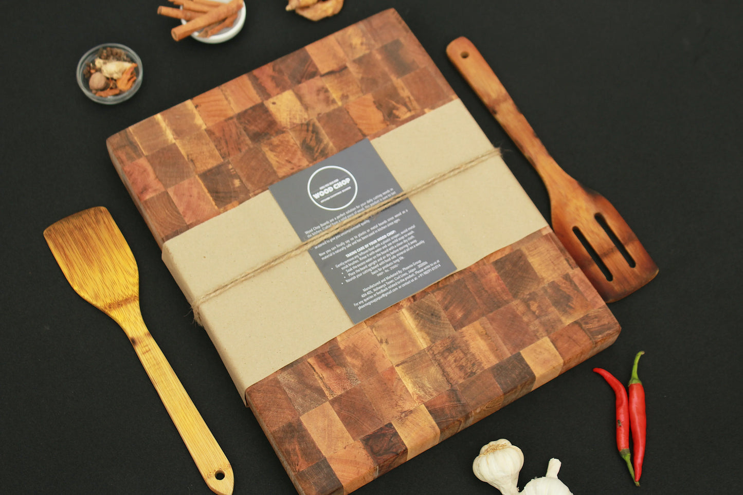 Board styled as a serving base for meats and garnishes at a rustic dinner setting.