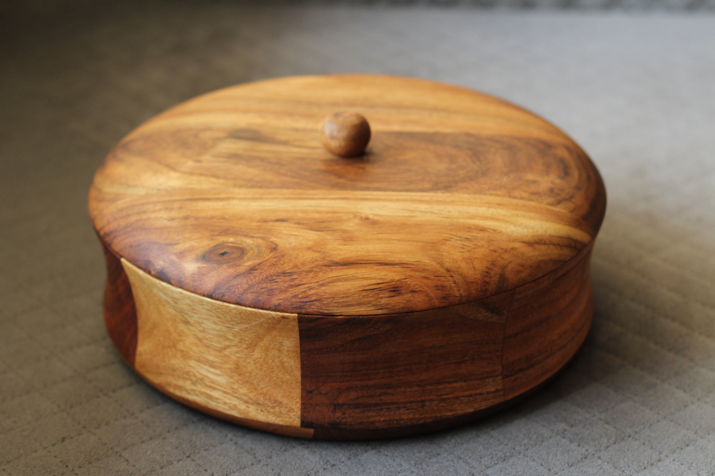 Top view of the acacia wood roti box with lid slightly open, showing spacious 9-inch diameter interior.