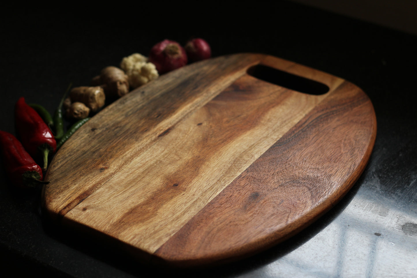 Chopping board in use during meal prep, emphasizing its sturdy, knife-friendly surface.