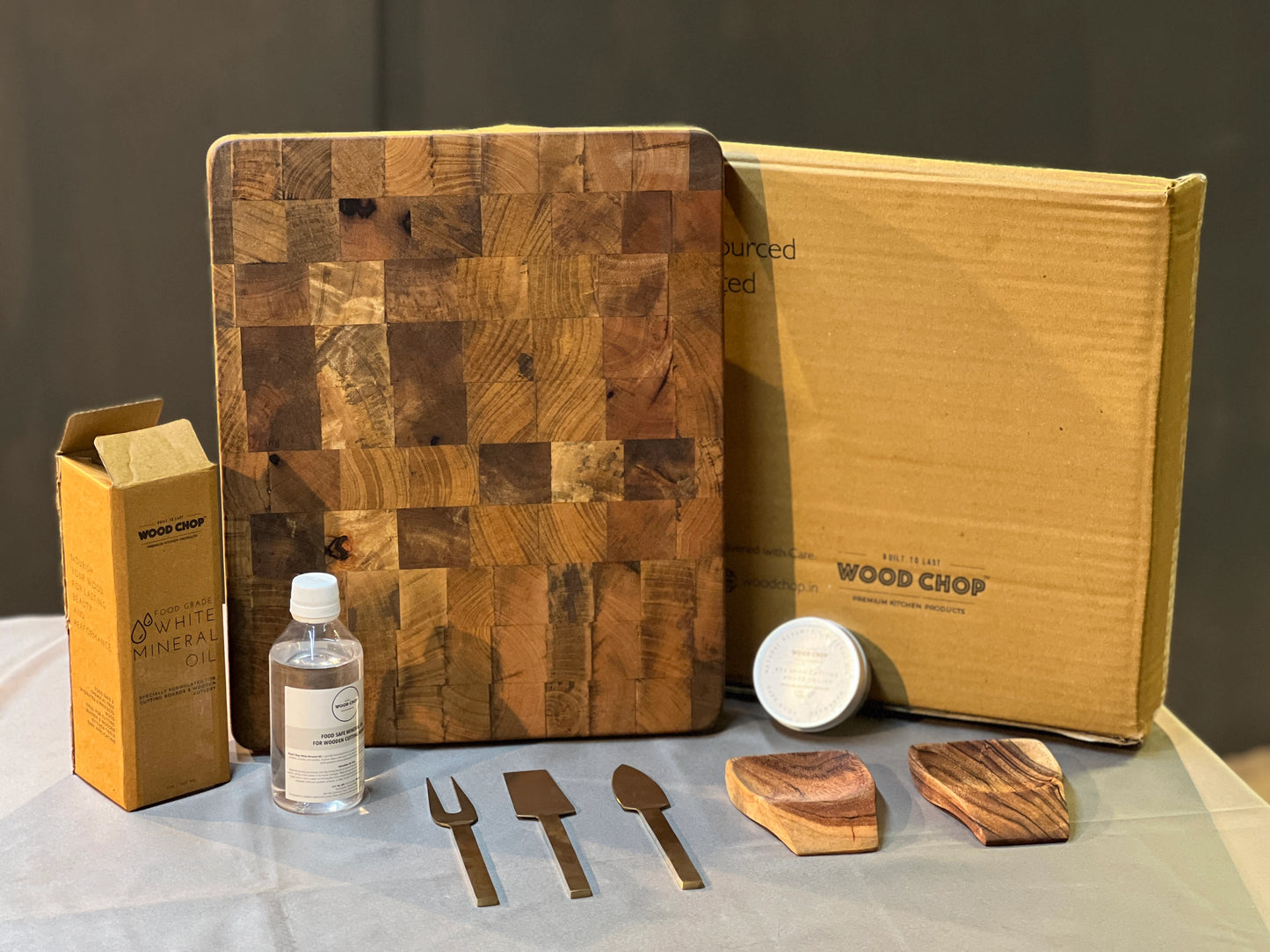 Close-up of acacia wood items included in the gift pack, showcasing the fine craftsmanship and smooth finish.