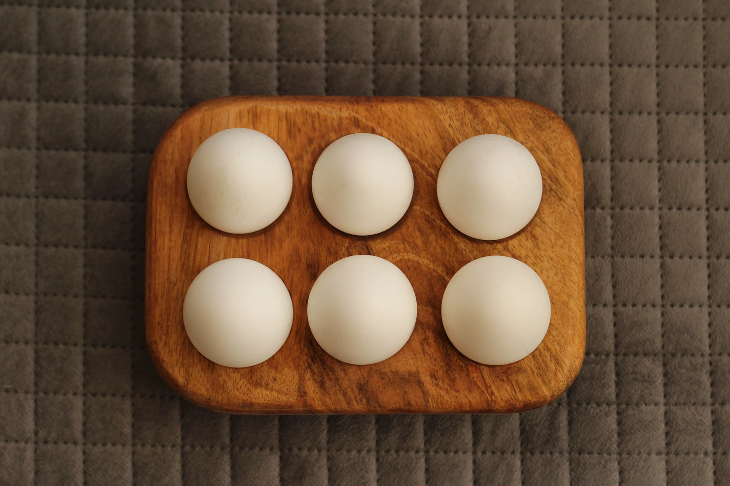 Side angle showing the solid build and slightly elevated base of the egg tray.