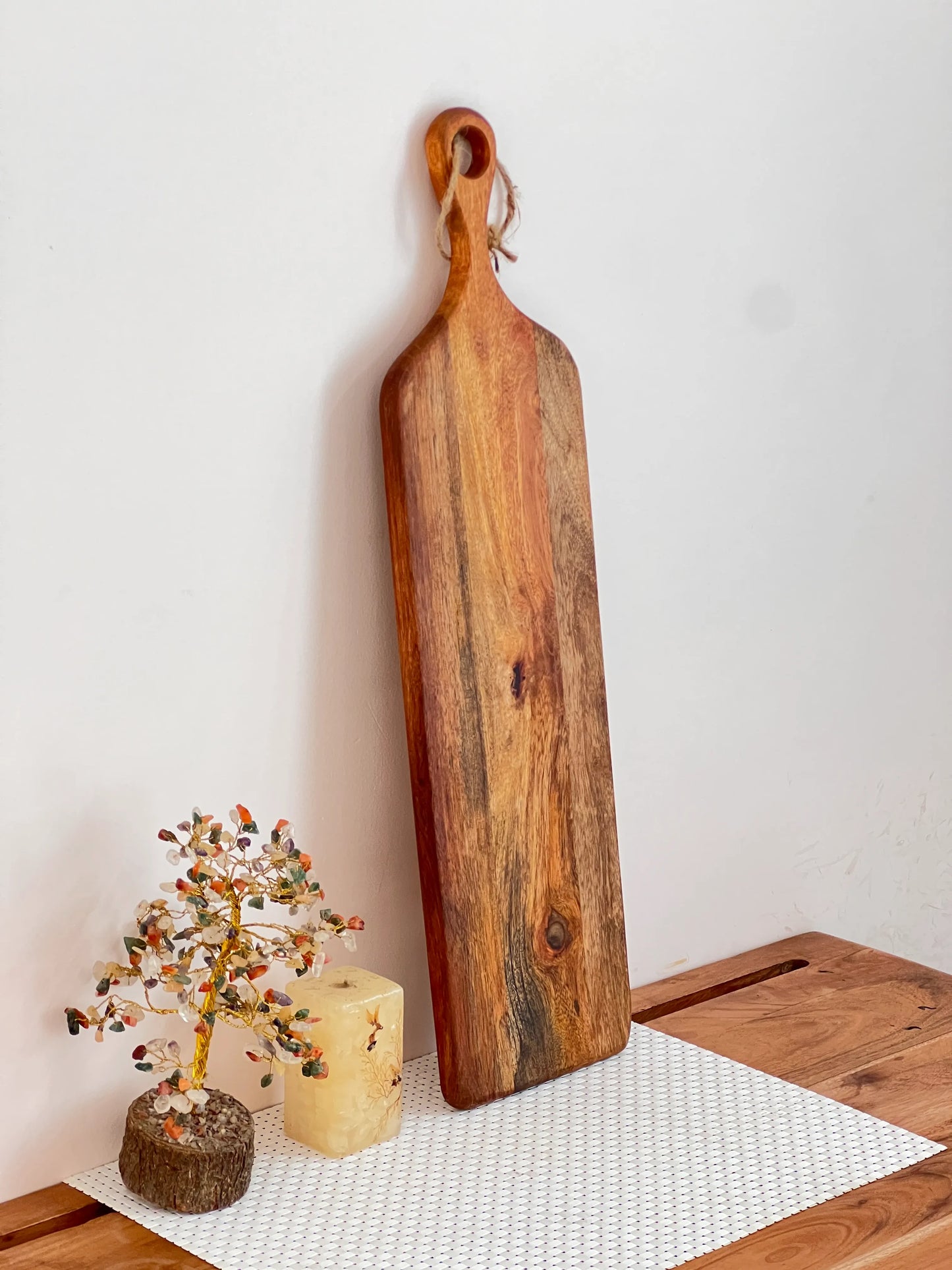 Close-up of mango wood texture with rich tones and smooth surface finish.