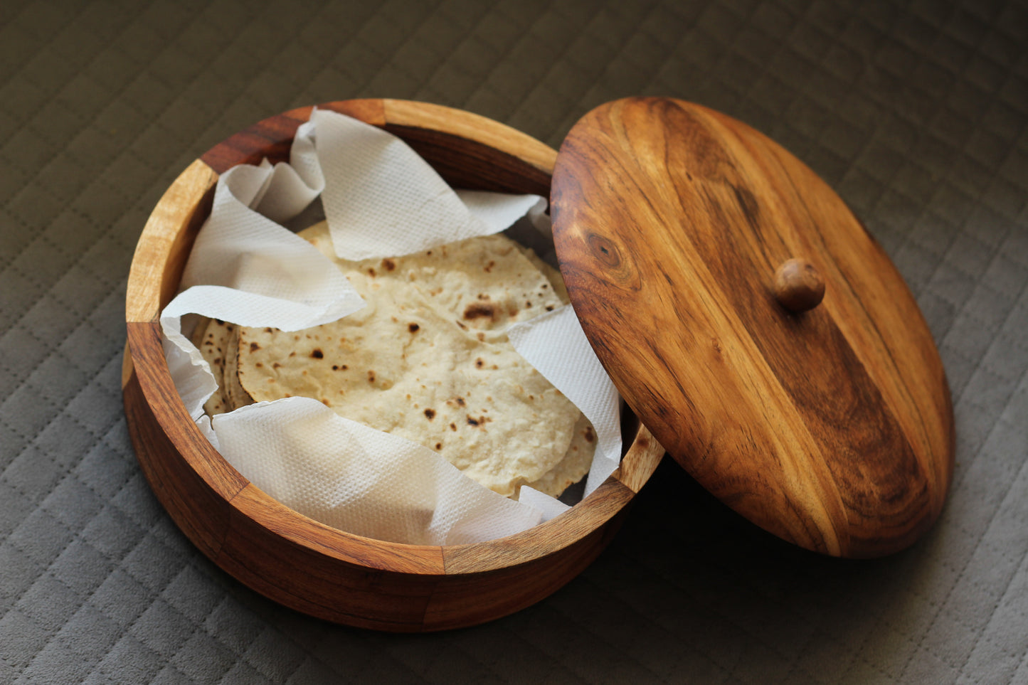 Roti box filled with fresh chapatis, emphasizing its functional use and traditional appeal.