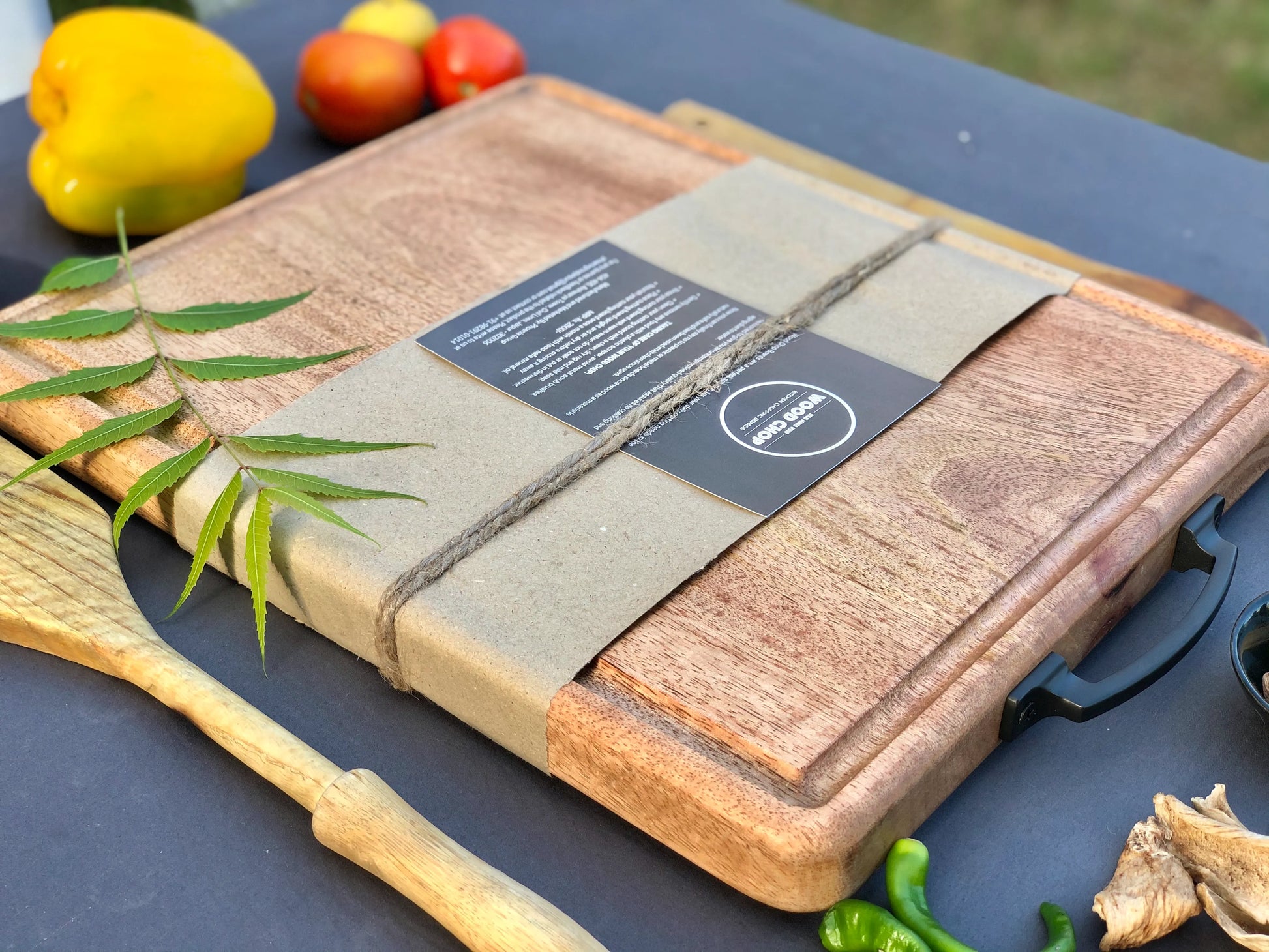 Flat-lay of the board holding a sliced roast and herbs with no juice spills.