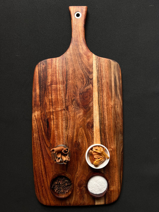 Top view of a 21x10 inch acacia wood cutting board with smooth natural finish.