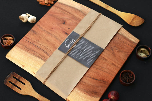 Top view of a 15x12 inch single-piece acacia chopping board with a natural live edge.