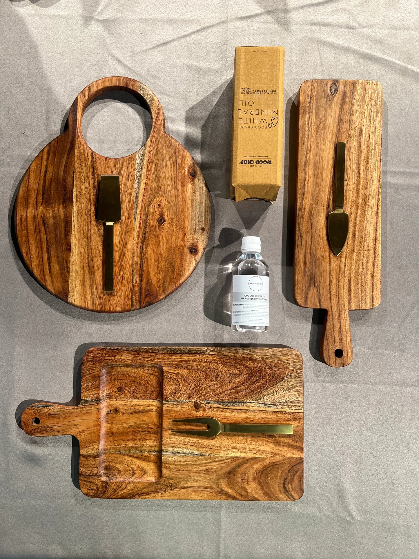 Close-up of the grain and finish on one of the acacia wooden pieces included in the Cozy Gift Set.