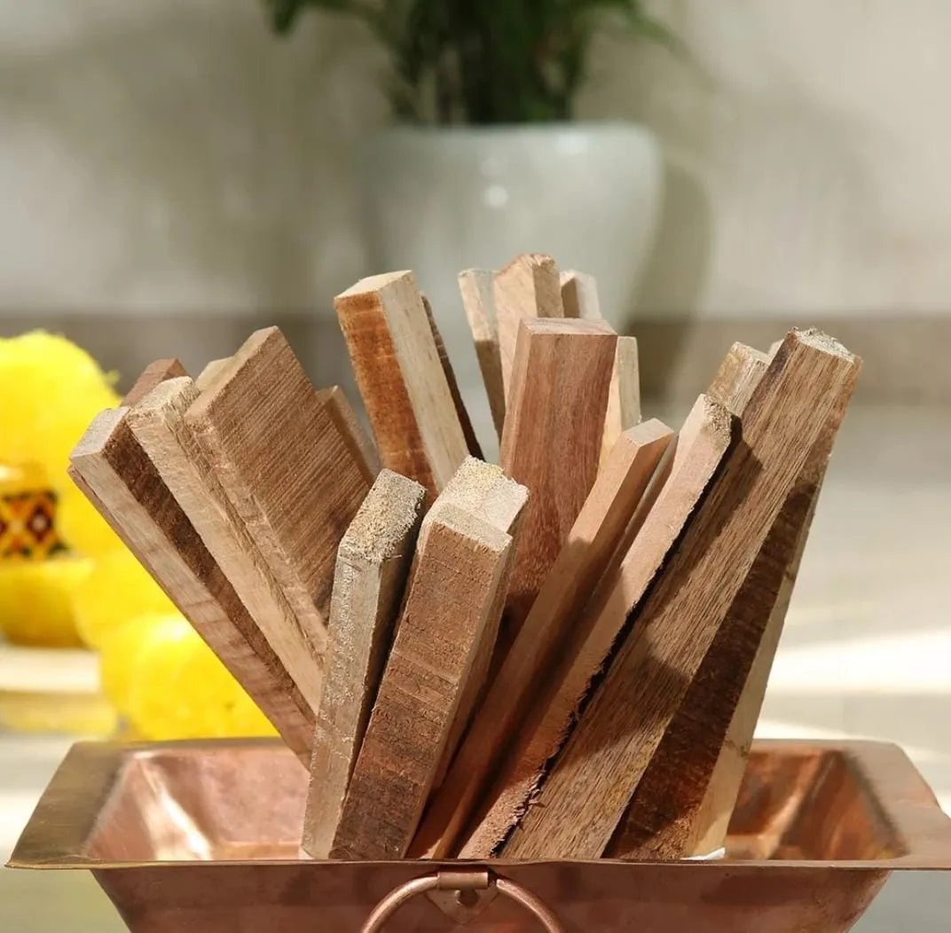 Close-up of the natural mango wood texture, cut and stacked for sacred fire ceremonies.