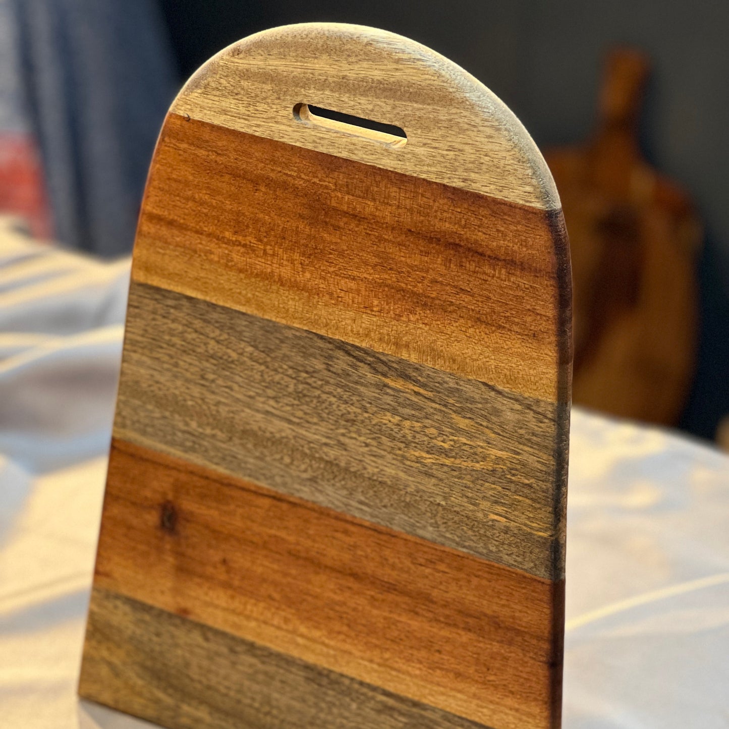 Side angle showing the 0.5-inch thickness and smooth beveled edges of the wooden tray.