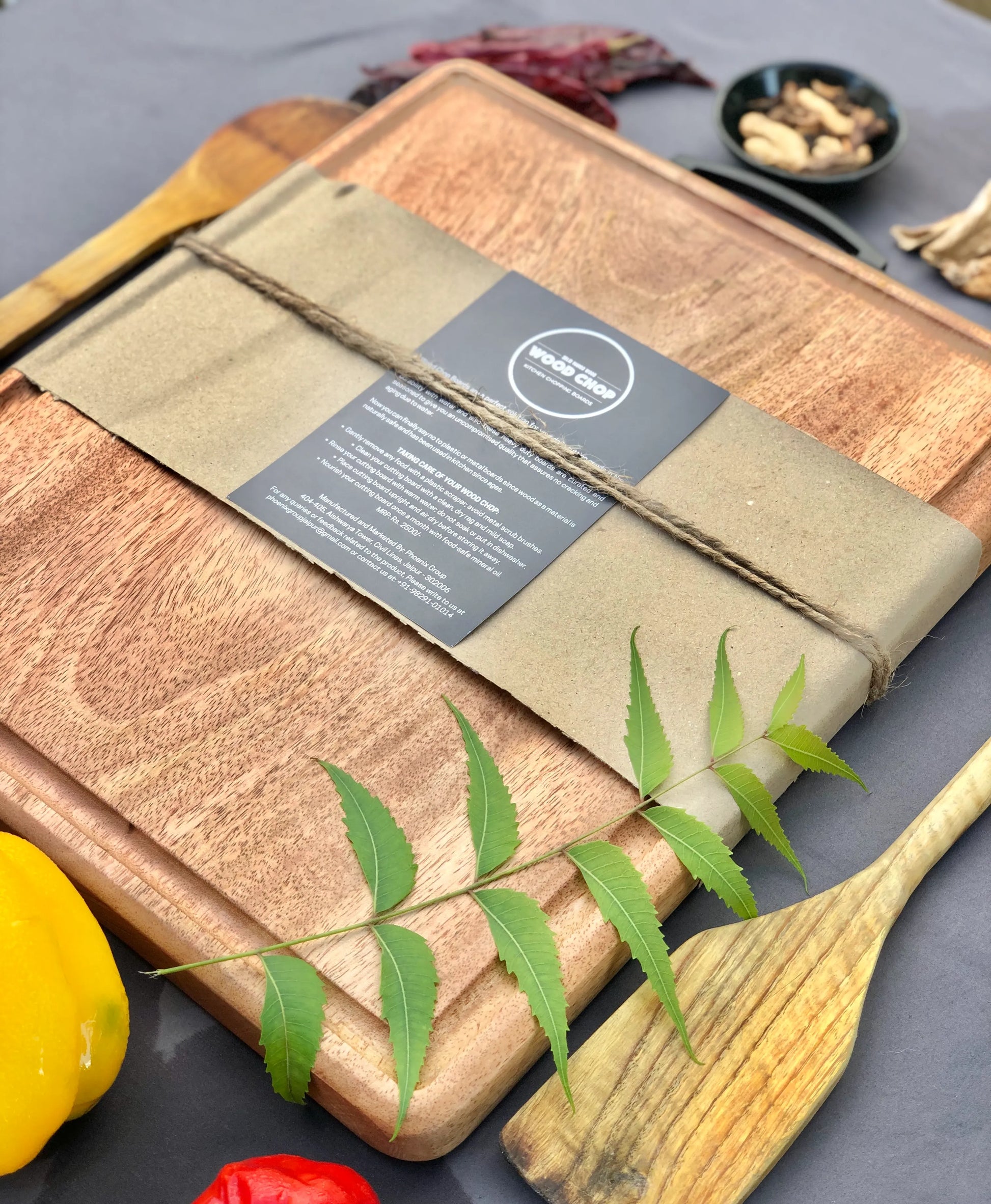 Angle shot showing the natural grain pattern and rich tones of the mango wood.