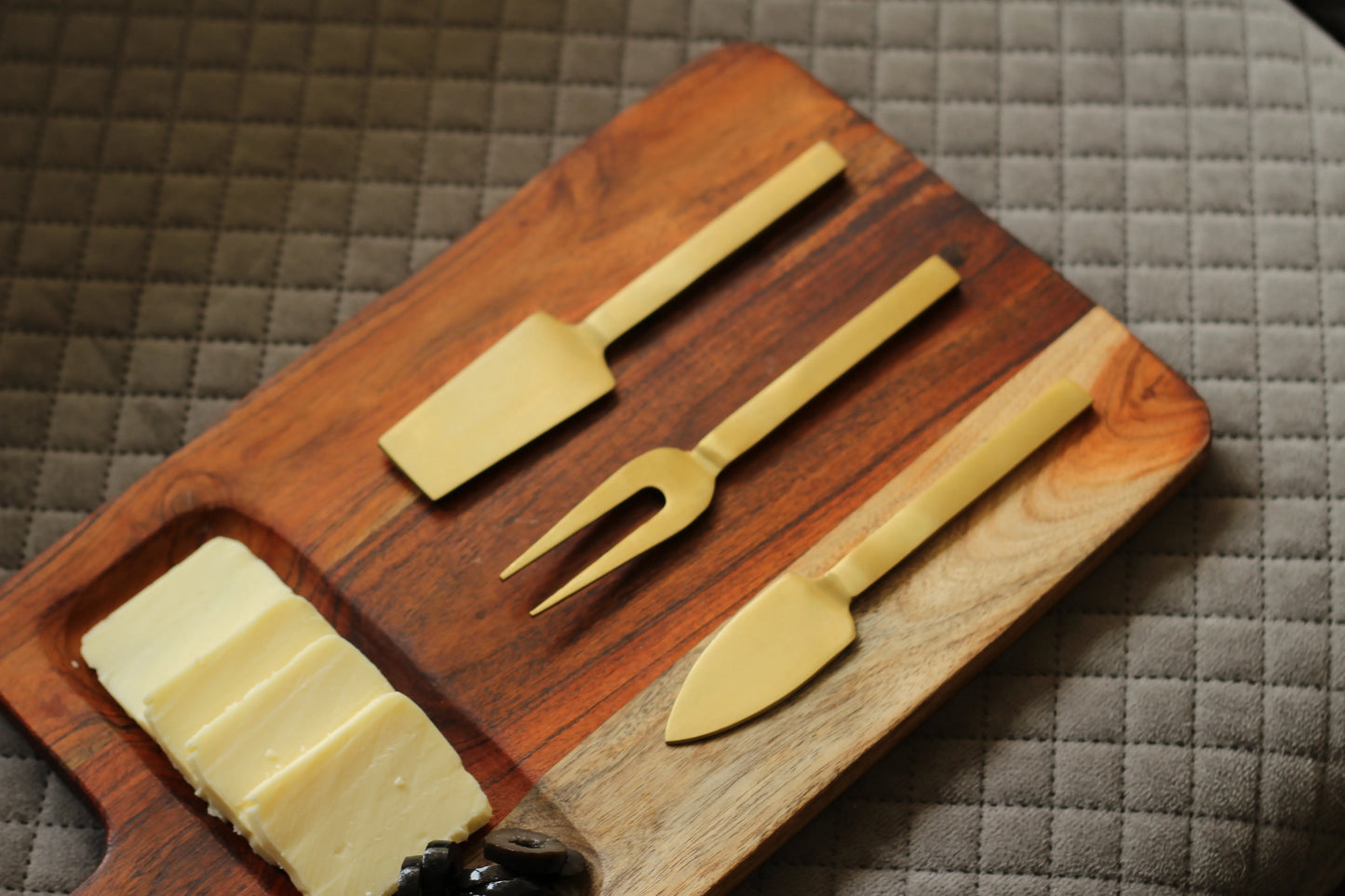 Close-up of gold-finished blades and ergonomic handles reflecting light beautifully.