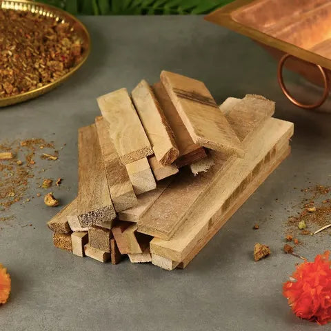 Top view of mango wood pieces neatly arranged for Hawan use in spiritual rituals.