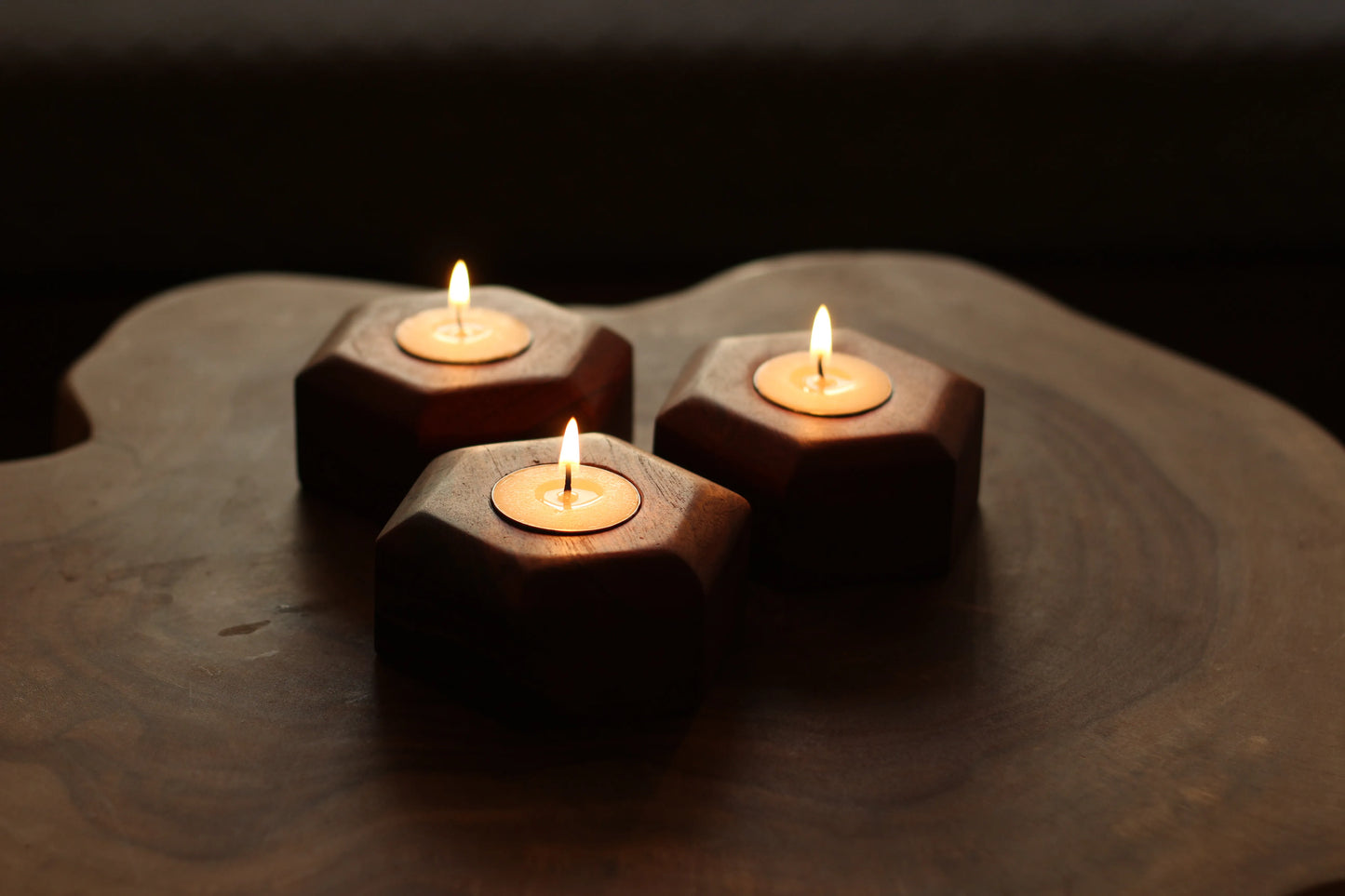 Close-up of a single tealight holder showing the natural wood grain and smooth finish.