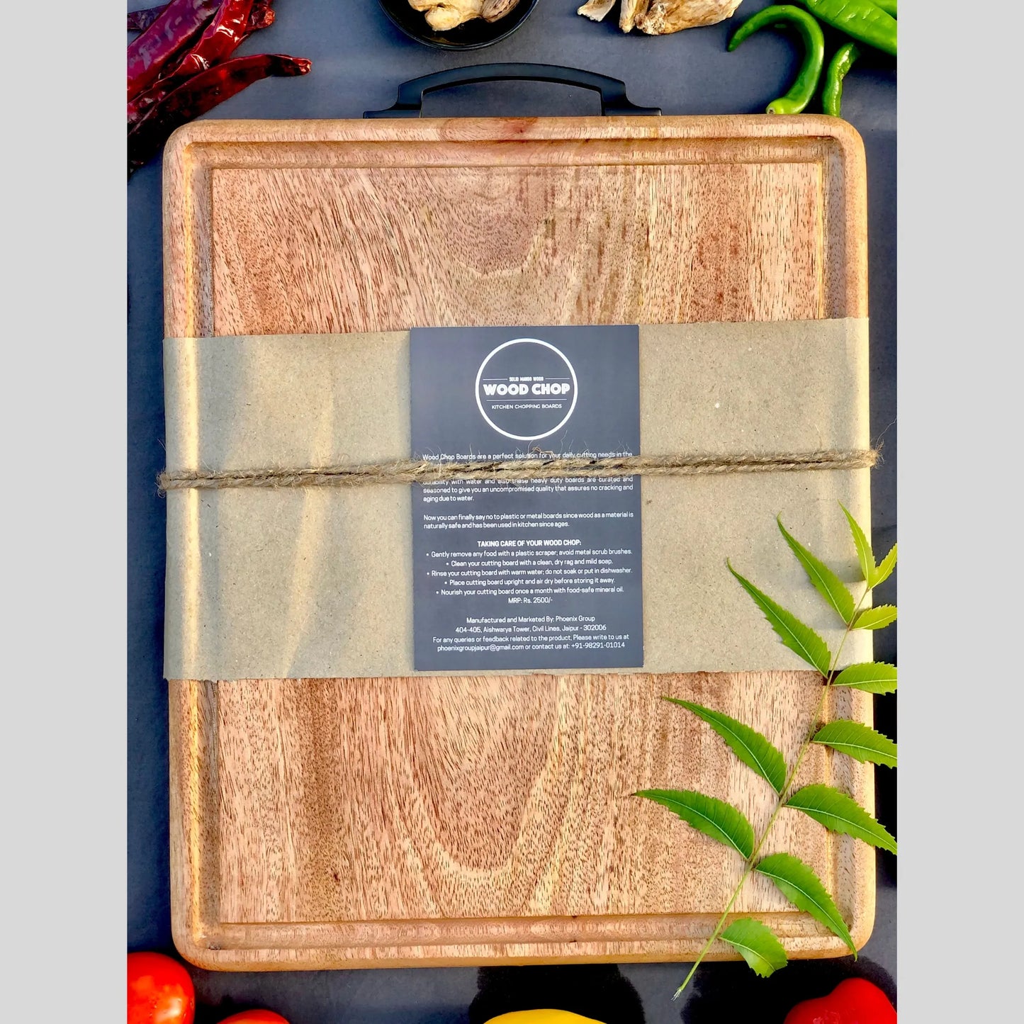 Top view of a 15x12 inch mango wood cutting board with a carved juice groove around the edge.