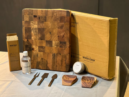 Flat lay of the Chef’s Choice Gift Pack featuring wooden boards, spoons, and serving pieces in elegant packaging.